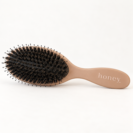Honey tan boar bristle hair extension brush